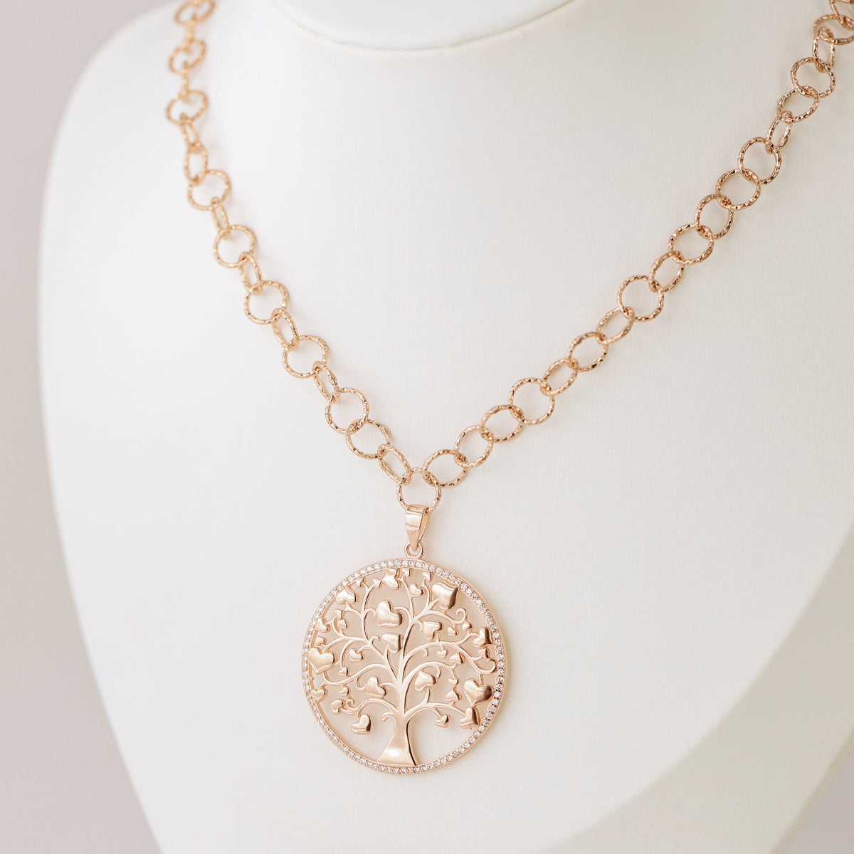 Indulge in luxury with our Tree of Life with Hearts Necklace. Crafted in rose gold, this delicate pendant features a dazzling pave tree of life design, symbolizing family and love. Perfect for Mother's Day, this necklace is a heartfelt gift that will be cherished for years to come.