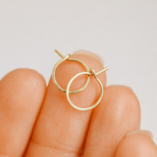 Detailed view of a handmade 14k gold filled hoop earring featuring a secure loop-and-hook closure, minimalist design for lobe and cartilage piercings.