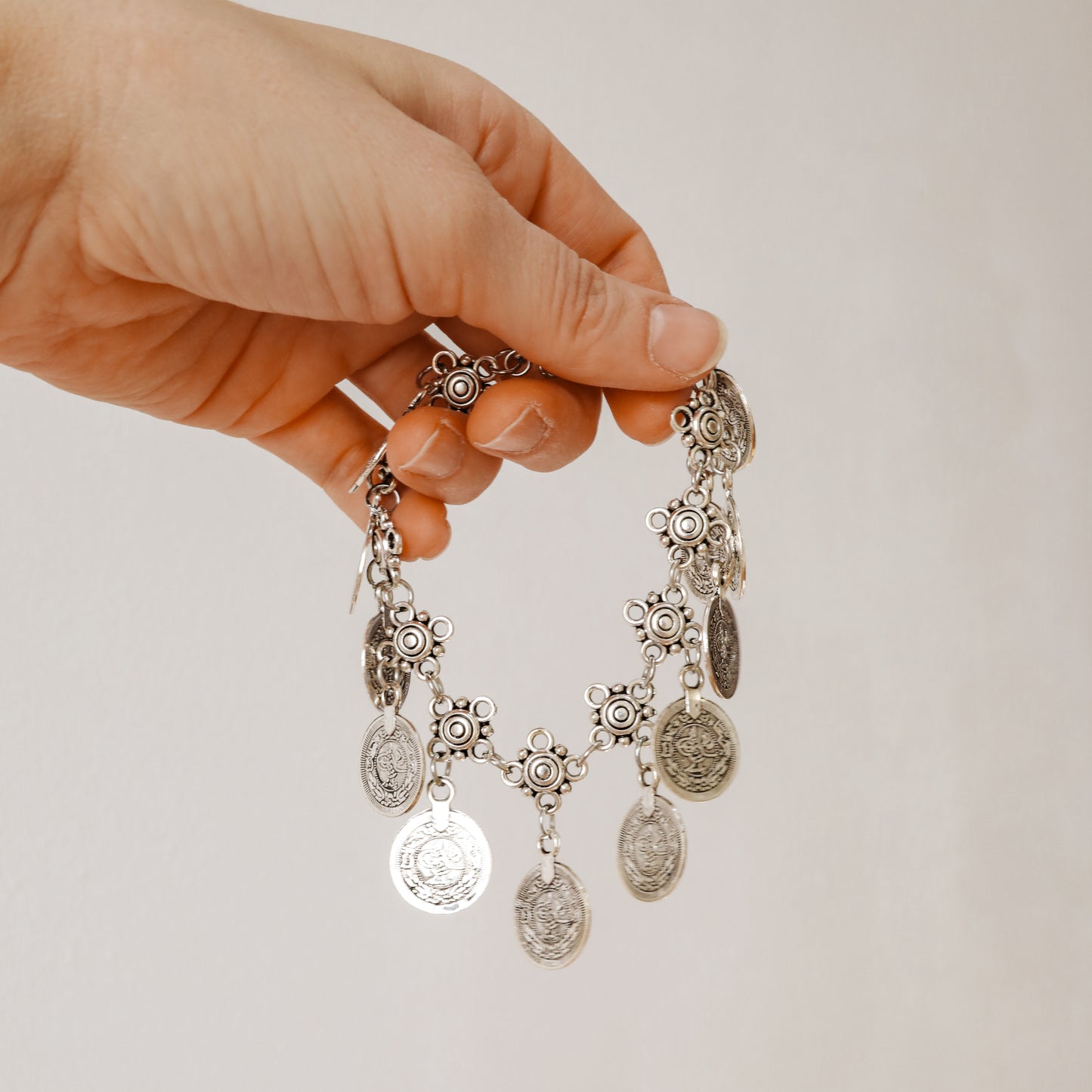 Silver-tone boho anklet with decorative chain and round coin charms