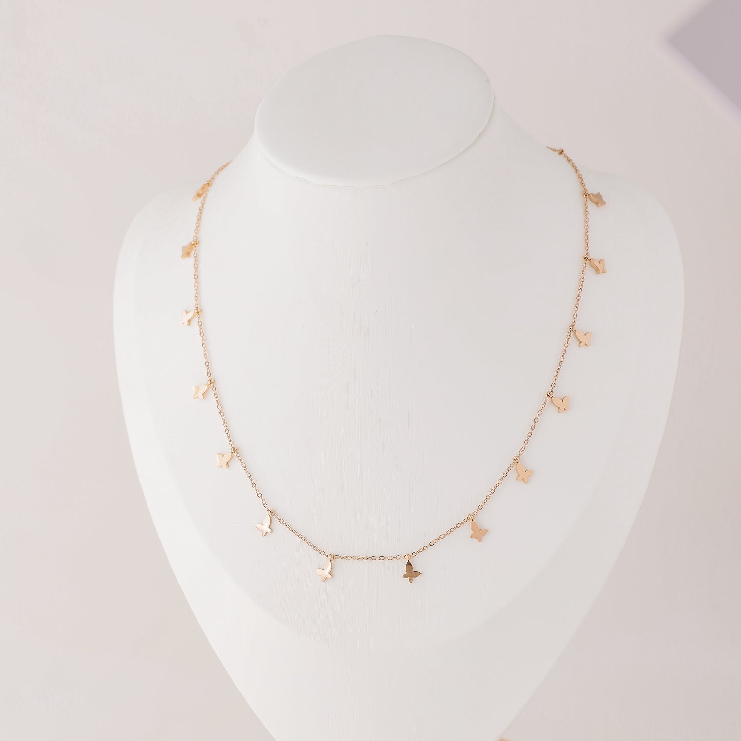 Indulge in the ethereal charm of our Butterflies Necklace! This dainty and minimal boho beaded necklace features delicate gold butterflies, creating a layered and feminine look. Perfect for adding a touch of bohemian flair to any outfit. Elevate your style with our Butterflies Necklace!