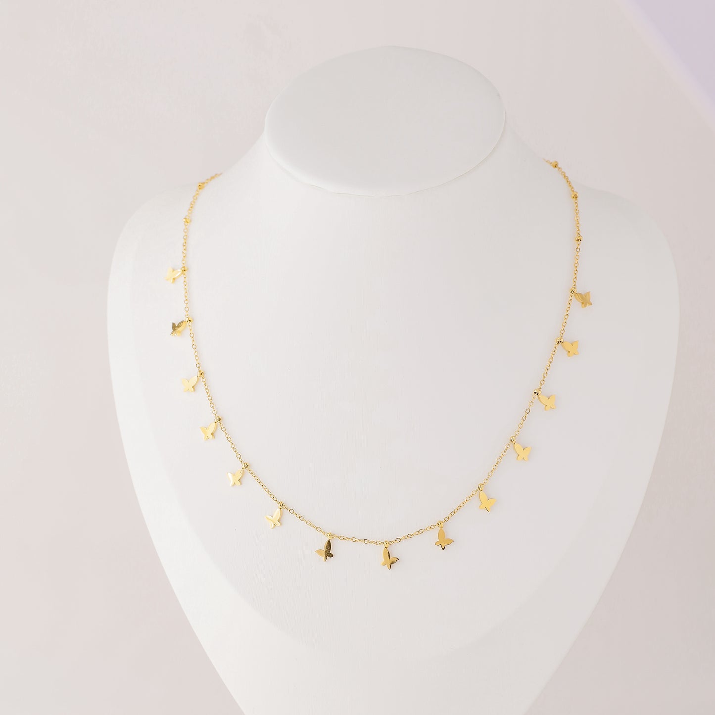 Indulge in the ethereal charm of our Butterflies Necklace! This dainty and minimal boho beaded necklace features delicate gold butterflies, creating a layered and feminine look. Perfect for adding a touch of bohemian flair to any outfit. Elevate your style with our Butterflies Necklace!