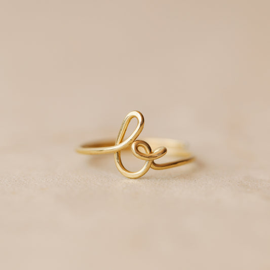 Handmade 14k gold filled wire ring shaped into the letter B.