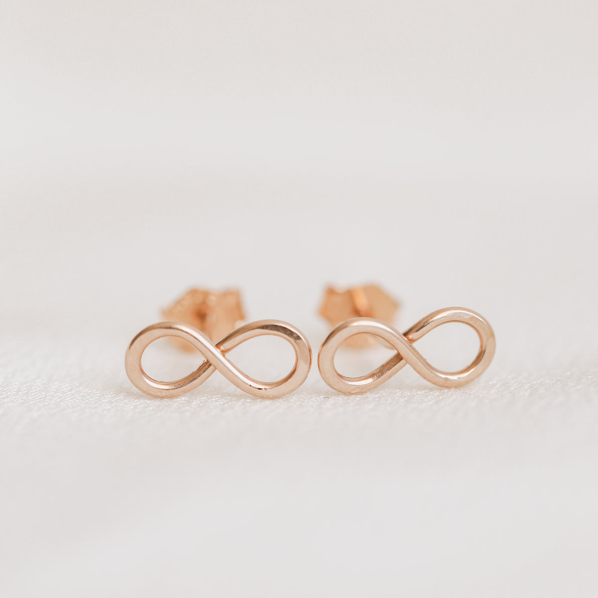 Rose gold infinity knot stud earrings dainty minimalist jewelry