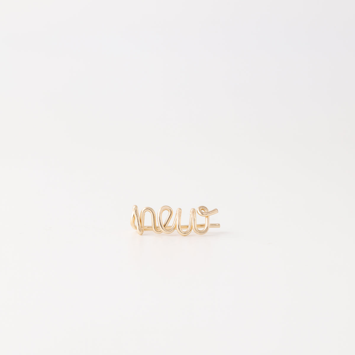 Handmade personalized name ear climber worn across the lobe through one standard piercing, featuring a custom flowing wire script design made with the chosen name or word up to 10 characters, available as a single left ear climber, single right ear climber or pair in solid 925 sterling silver, 14k gold filled and 14k rose gold filled.