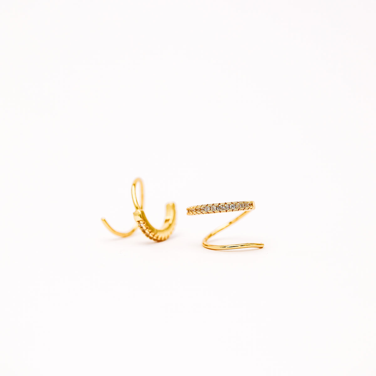 Single piercing double hoop illusion huggie earring close up