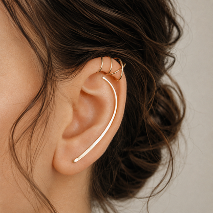 Handmade 50 mm ear climber and ear cuff set worn along the ear to create a long minimalist layered ear stack, featuring one hand hammered ear climber for a standard lobe piercing and matching no-piercing upper cartilage cuffs, including Double Line and Criss-Cross helix cuff styles, available as left ear, right ear, pair or multi-piece set options in solid 925 sterling silver, 14k gold filled and 14k rose gold filled, with ear climber lengths available from 10mm to 50mm.