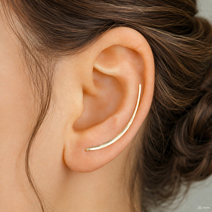 Handmade 50 mm minimalist ear climber earrings worn through one standard lobe piercing and rotated upward to follow the natural curve of the ear, featuring a long clean hand hammered wire design with an elegant ear sweep shape, available as a single left ear climber, single right ear climber or pair in solid 925 sterling silver, 14k gold filled and 14k rose gold filled, with length options from 10mm to 50mm.