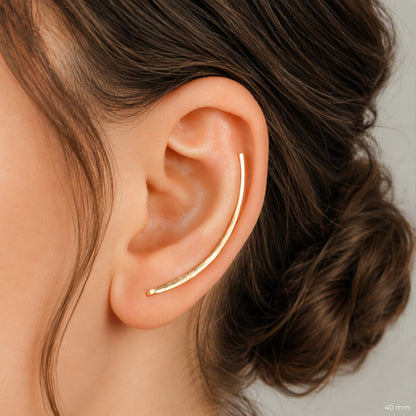 Handmade 50 mm minimalist ear climber earrings worn through one standard lobe piercing and rotated upward to follow the natural curve of the ear, featuring a long clean hand hammered wire design with an elegant ear sweep shape, available as a single left ear climber, single right ear climber or pair in solid 925 sterling silver, 14k gold filled and 14k rose gold filled, with length options from 10mm to 50mm.