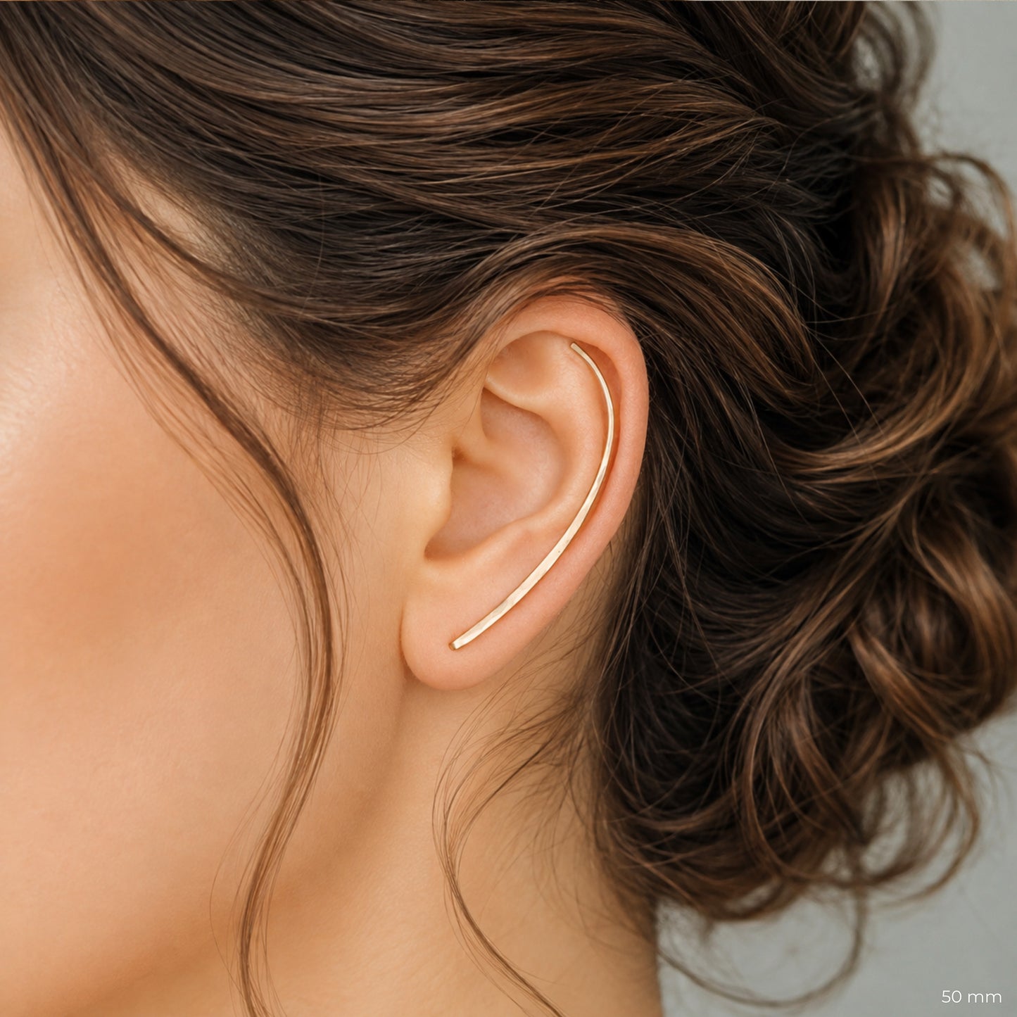Handmade 50 mm minimalist ear climber earrings worn through one standard lobe piercing and rotated upward to follow the natural curve of the ear, featuring a long clean hand hammered wire design with an elegant ear sweep shape, available as a single left ear climber, single right ear climber or pair in solid 925 sterling silver, 14k gold filled and 14k rose gold filled, with length options from 10mm to 50mm.