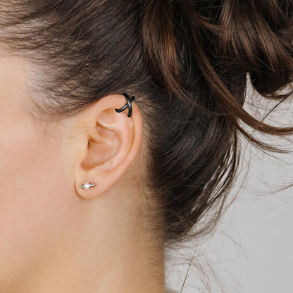Adjustable no-piercing helix ear cuff shown worn on the upper cartilage area, available in soft gold, silver and black with Double Line and Criss-Cross style options for a bold stacked ear look.