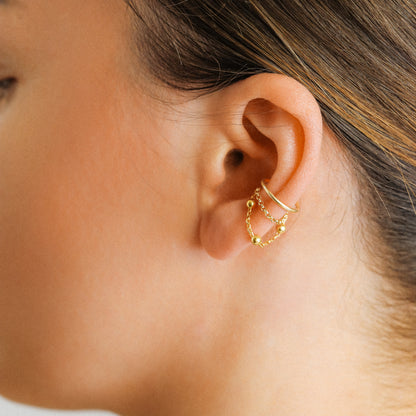Gold beaded chain ear cuff worn on the conch with double draped chain detail