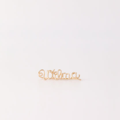Handmade personalized name ear climber worn across the lobe through one standard piercing, featuring a custom flowing wire script design made with the chosen name or word up to 10 characters, available as a single left ear climber, single right ear climber or pair in solid 925 sterling silver, 14k gold filled and 14k rose gold filled.