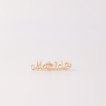 Handmade personalized name ear climber worn across the lobe through one standard piercing, featuring a custom flowing wire script design made with the chosen name or word up to 10 characters, available as a single left ear climber, single right ear climber or pair in solid 925 sterling silver, 14k gold filled and 14k rose gold filled.