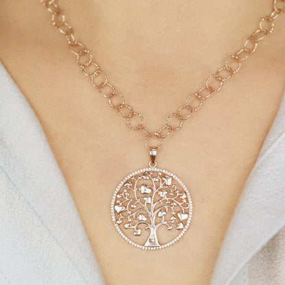 Indulge in luxury with our Tree of Life with Hearts Necklace. Crafted in rose gold, this delicate pendant features a dazzling pave tree of life design, symbolizing family and love. Perfect for Mother's Day, this necklace is a heartfelt gift that will be cherished for years to come.
