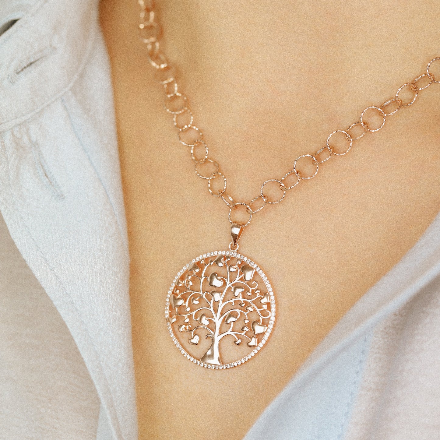 Indulge in luxury with our Tree of Life with Hearts Necklace. Crafted in rose gold, this delicate pendant features a dazzling pave tree of life design, symbolizing family and love. Perfect for Mother's Day, this necklace is a heartfelt gift that will be cherished for years to come.
