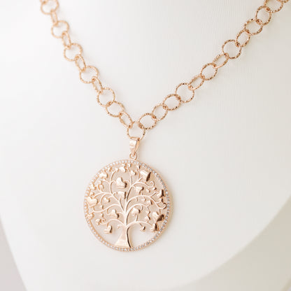Indulge in luxury with our Tree of Life with Hearts Necklace. Crafted in rose gold, this delicate pendant features a dazzling pave tree of life design, symbolizing family and love. Perfect for Mother's Day, this necklace is a heartfelt gift that will be cherished for years to come.