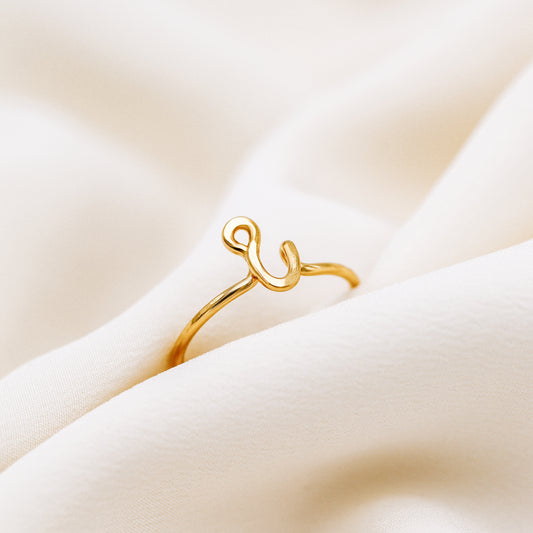 Handmade dainty gold wire ring with a lowercase cursive letter i