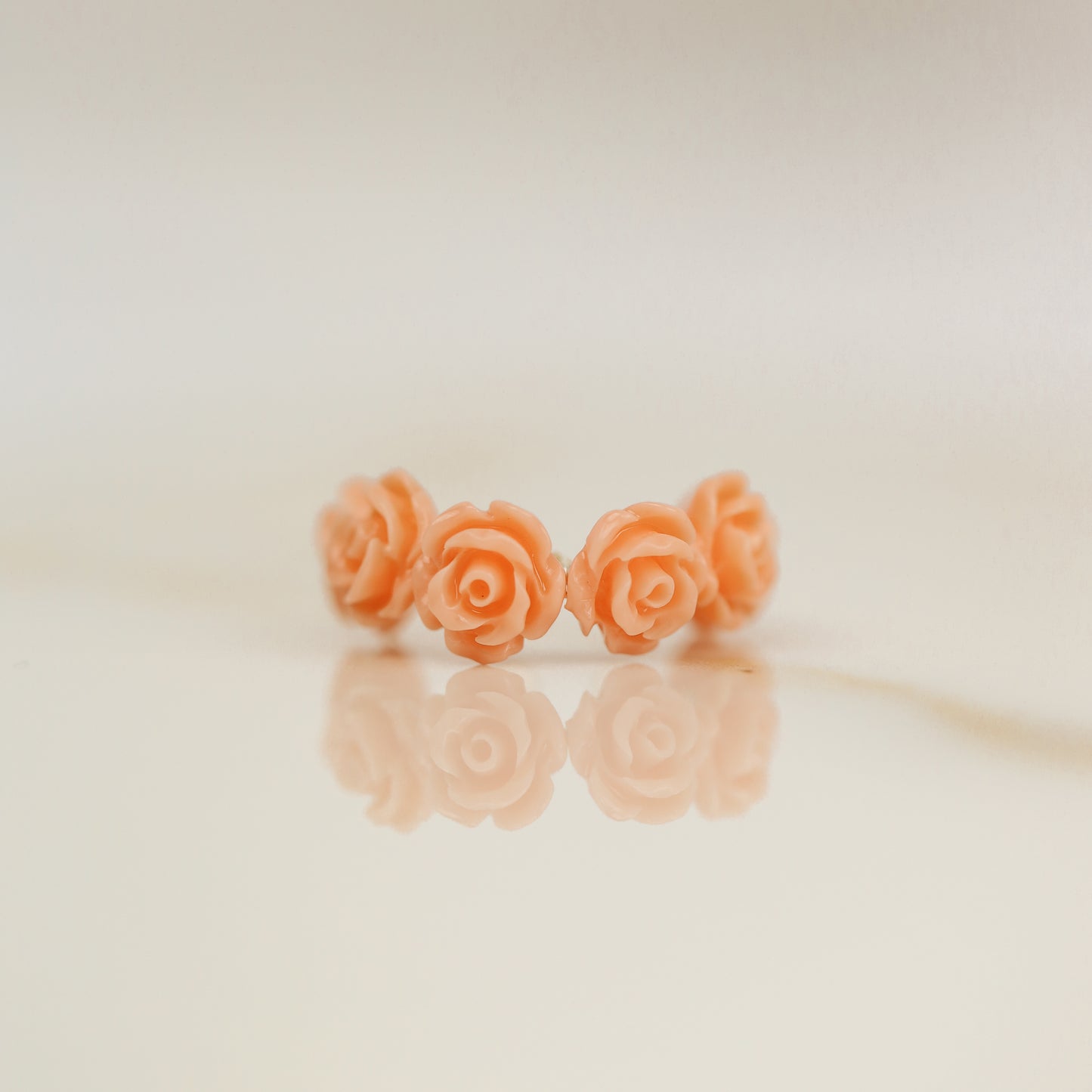 Peach coral resin rose conch ear cuff with dainty floral design and no piercing required