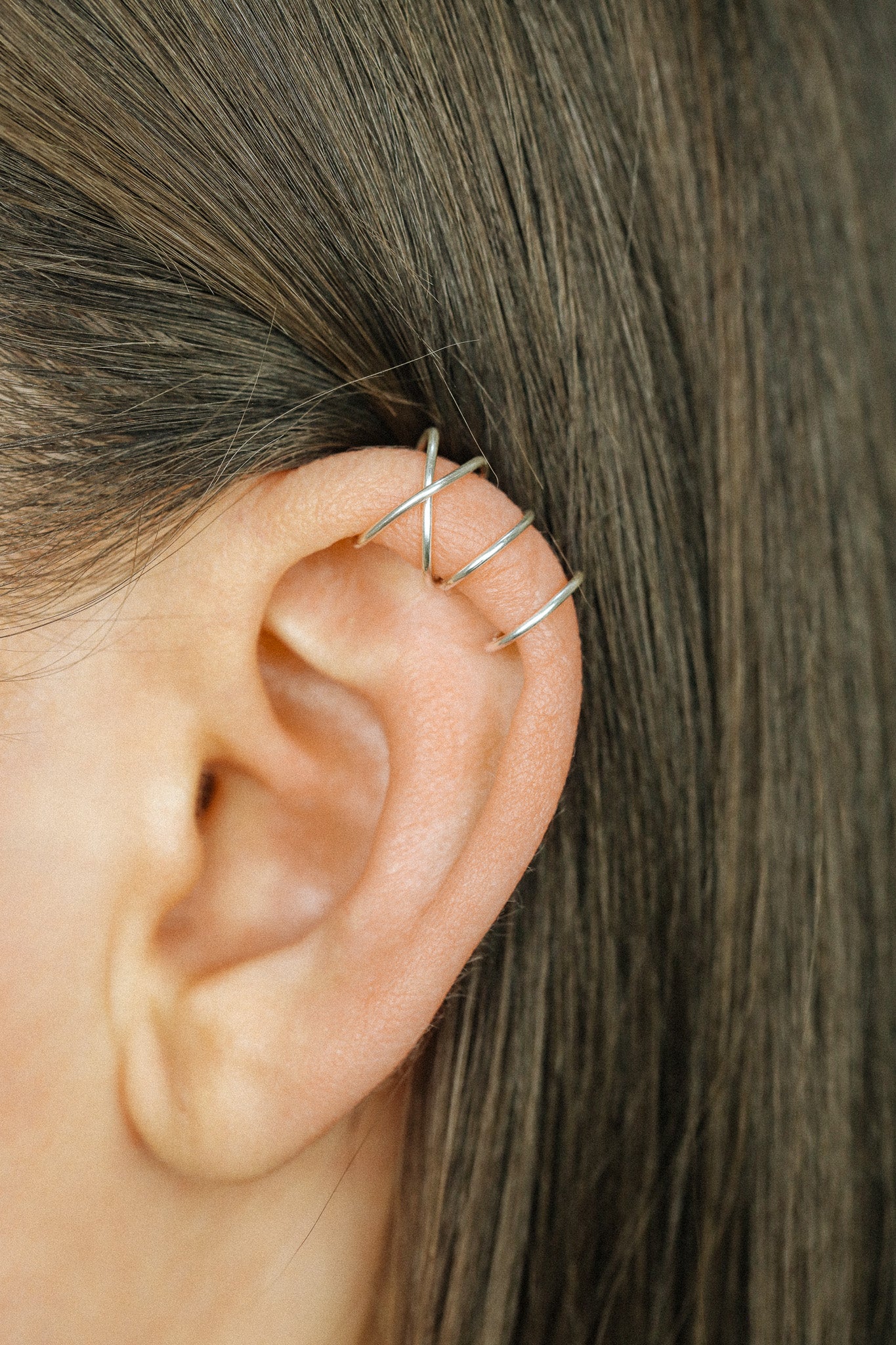 Handmade set of gold criss cross and double line helix ear cuffs for non-pierced ears, adjustable minimalist jewelry available in 12k gold filled, sterling silver, and 16 gauge black aluminum.