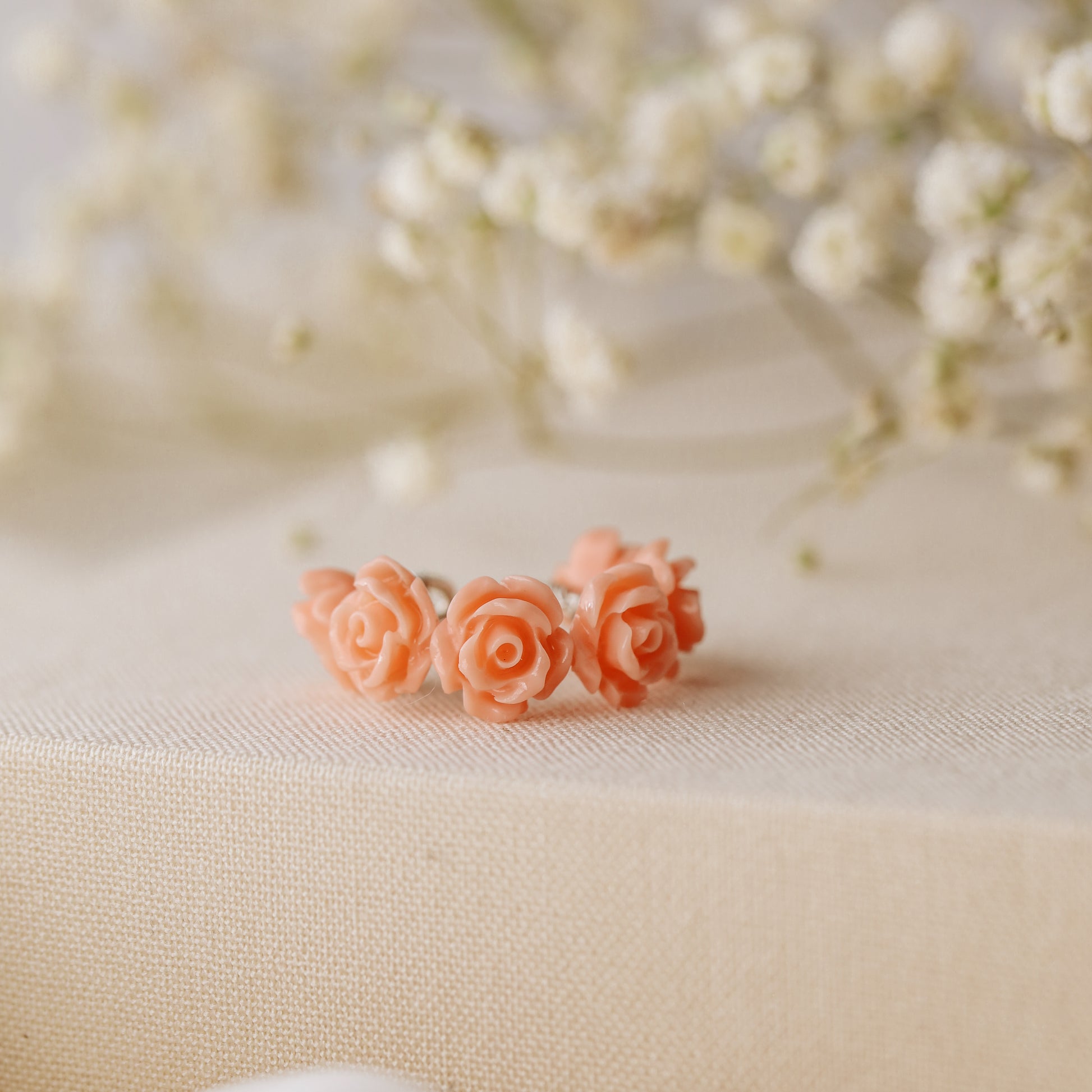Peach coral resin rose conch ear cuff with dainty floral design and no piercing required