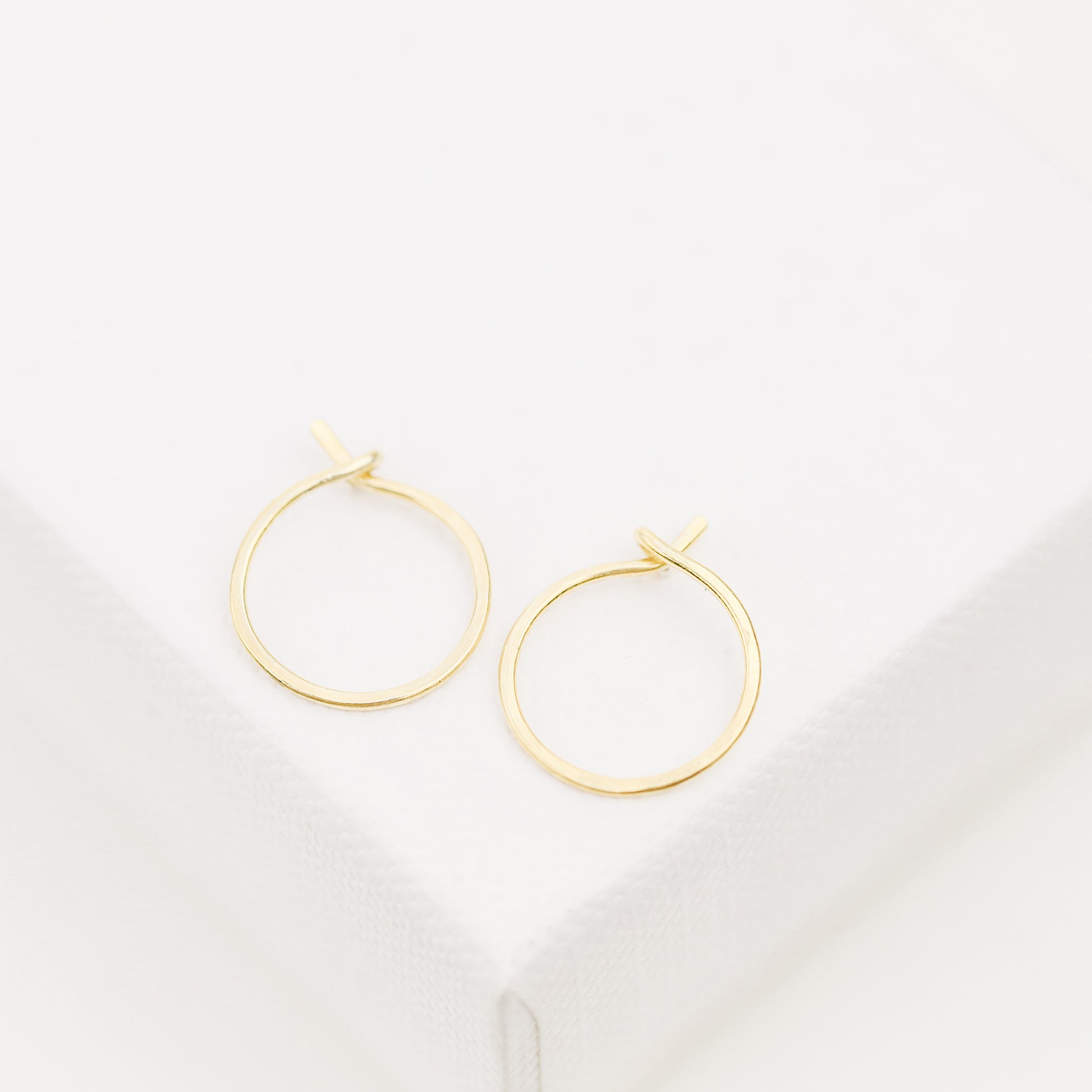 Detailed view of a handmade 12k gold filled hoop earring featuring a secure loop-and-hook closure, minimalist design for lobe and cartilage piercings.