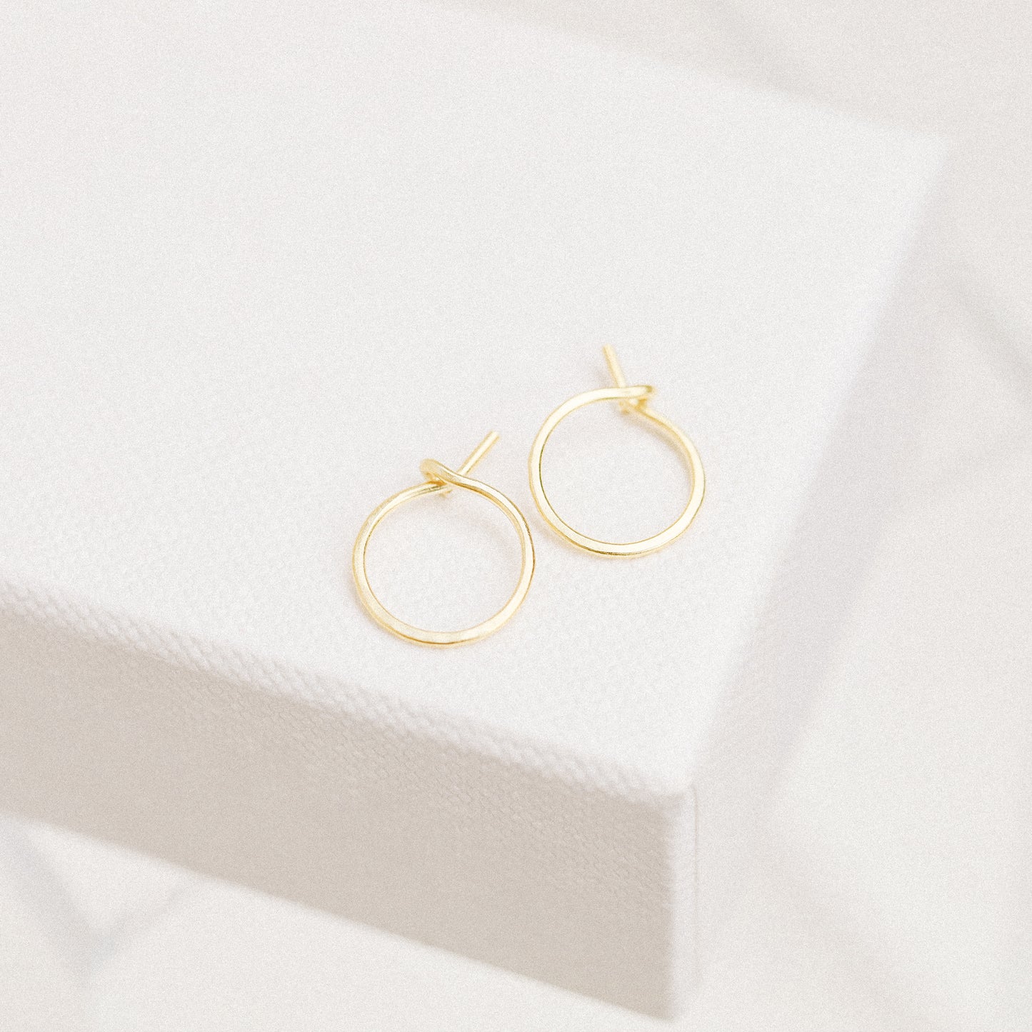 Detailed view of a handmade 12k gold filled hoop earring featuring a secure loop-and-hook closure, minimalist design for lobe and cartilage piercings.