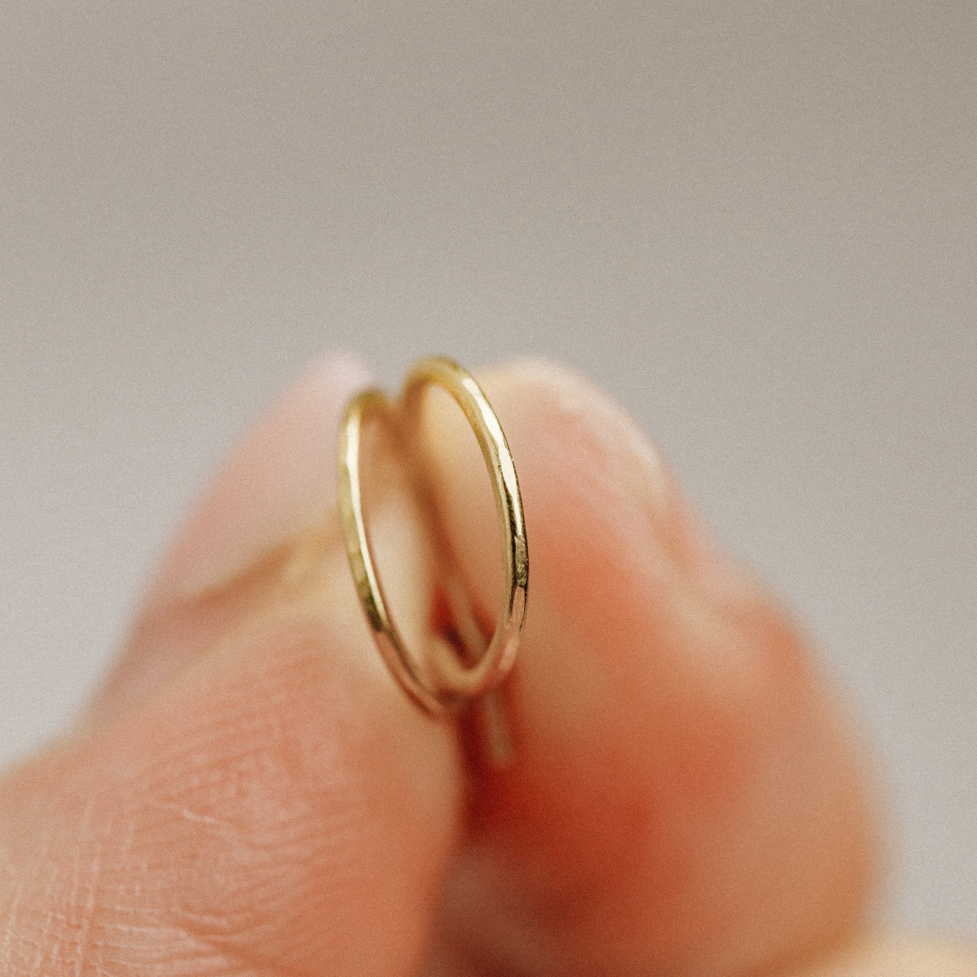 Detailed view of a handmade 12k gold filled hoop earring featuring a secure loop-and-hook closure, minimalist design for lobe and cartilage piercings.