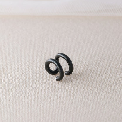 Adjustable no-piercing helix ear cuff shown worn on the upper cartilage area, available in silver, black and soft gold with Double Line and Criss-Cross style options for a bold stacked ear look.