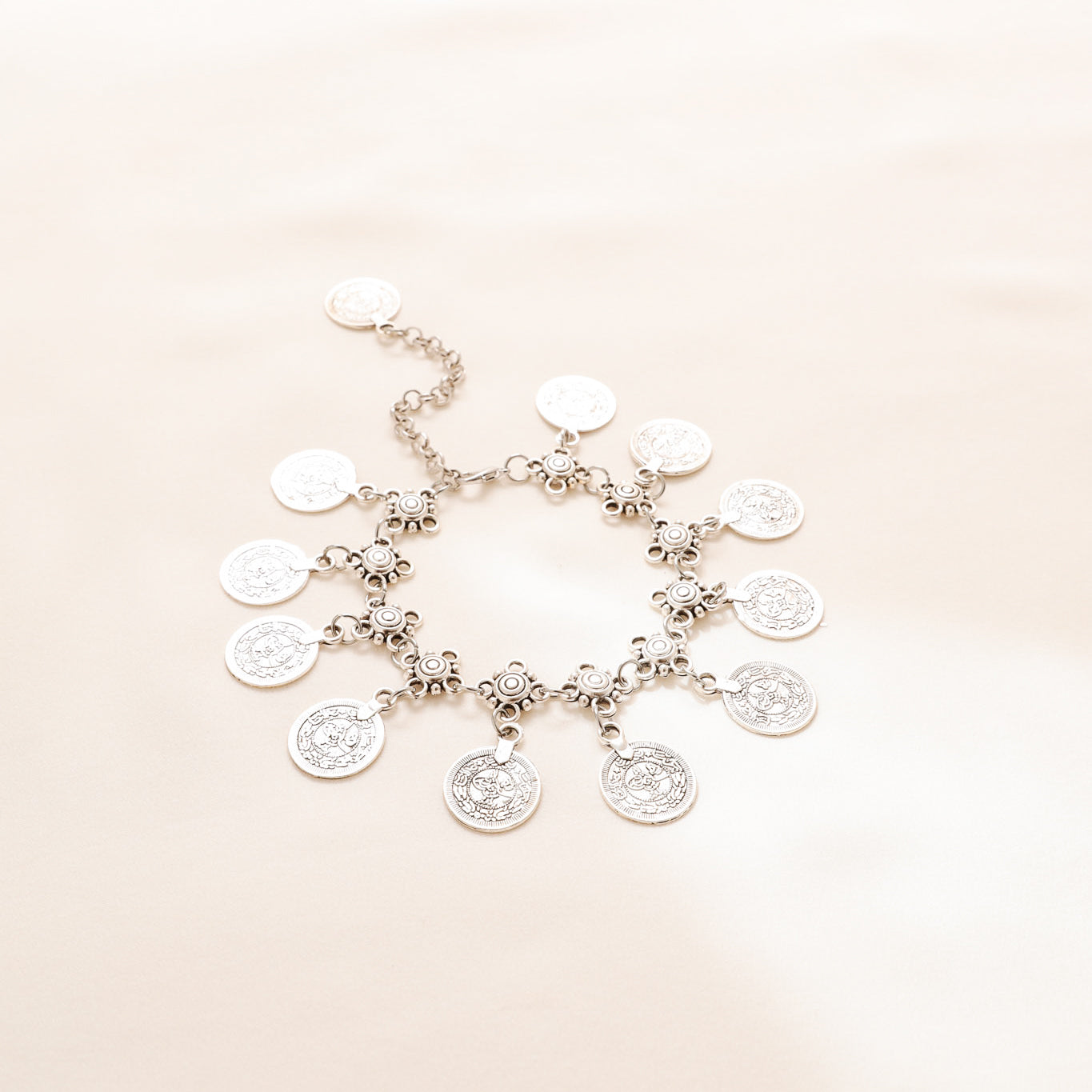 Silver-tone boho anklet with decorative chain and round coin charms