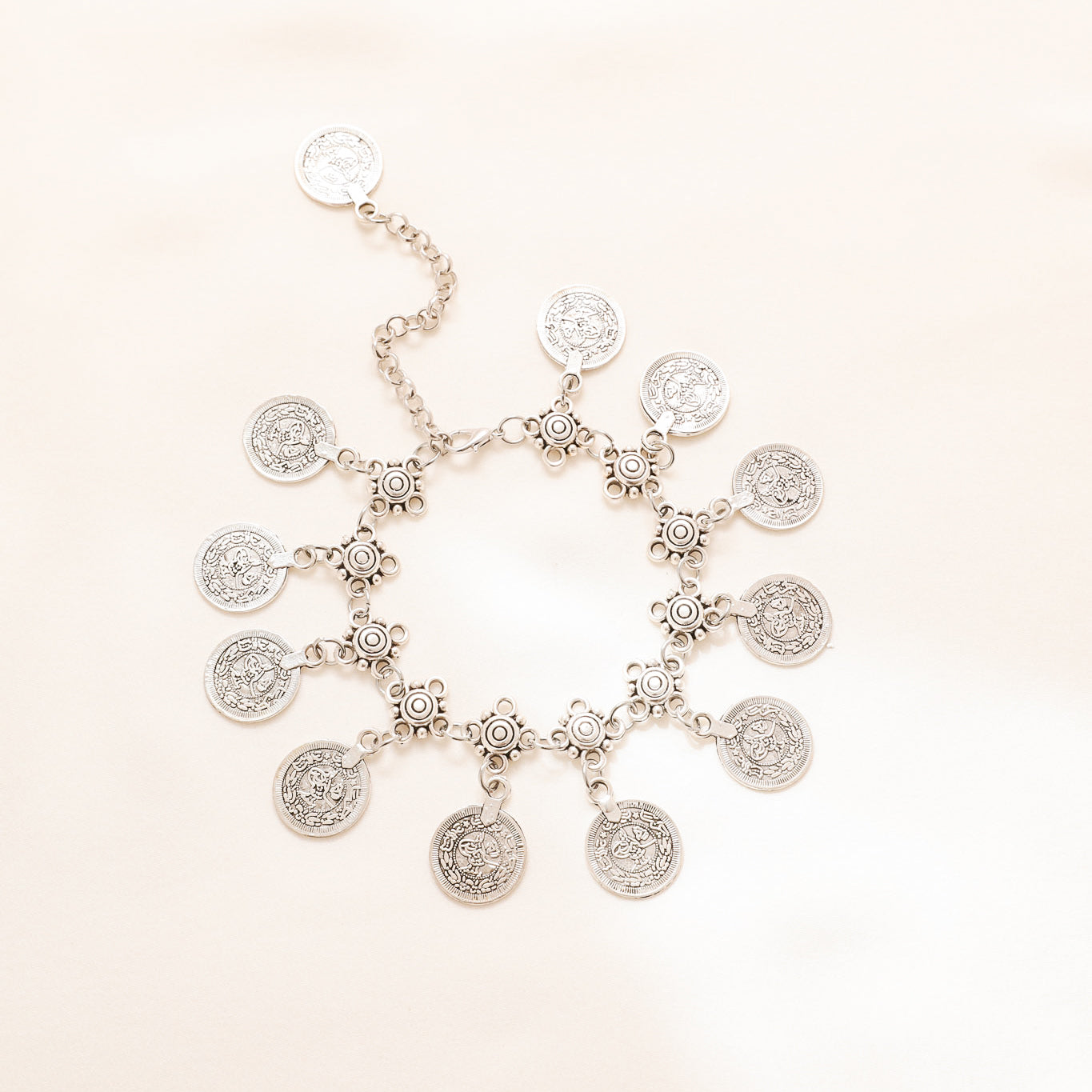 Silver-tone boho anklet with decorative chain and round coin charms