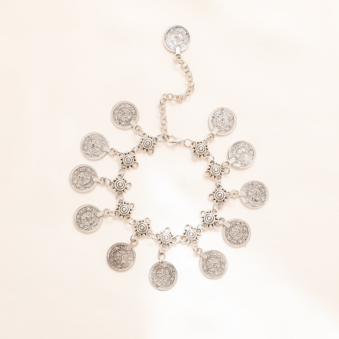 Adjustable silver coin charm anklet with dangling 17 mm coin-style charms and extender chain
