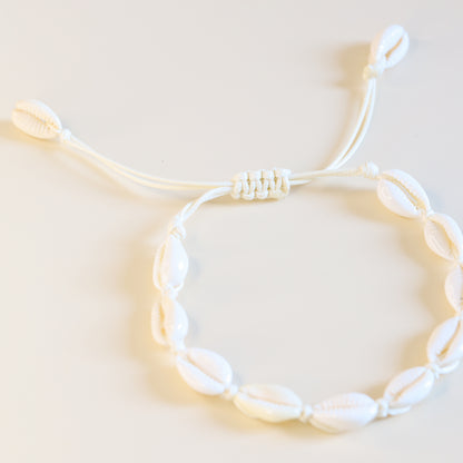 Adjustable cowrie shell anklet with sliding knot closure and natural white shells
