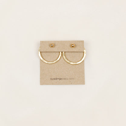 Pair of gold hammered round ear jackets displayed with matching ball studs, showing the coordinated two-ear configuration and interchangeable stud design.