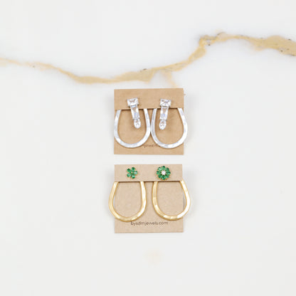 Selection of gold and silver teardrop ear jacket backs displayed with different stud styles to illustrate possible styling combinations.