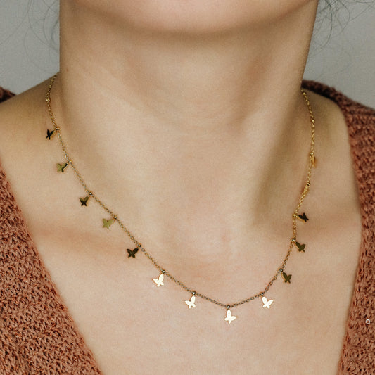 Indulge in the ethereal charm of our Butterflies Necklace! This dainty and minimal boho beaded necklace features delicate gold butterflies, creating a layered and feminine look. Perfect for adding a touch of bohemian flair to any outfit. Elevate your style with our Butterflies Necklace!