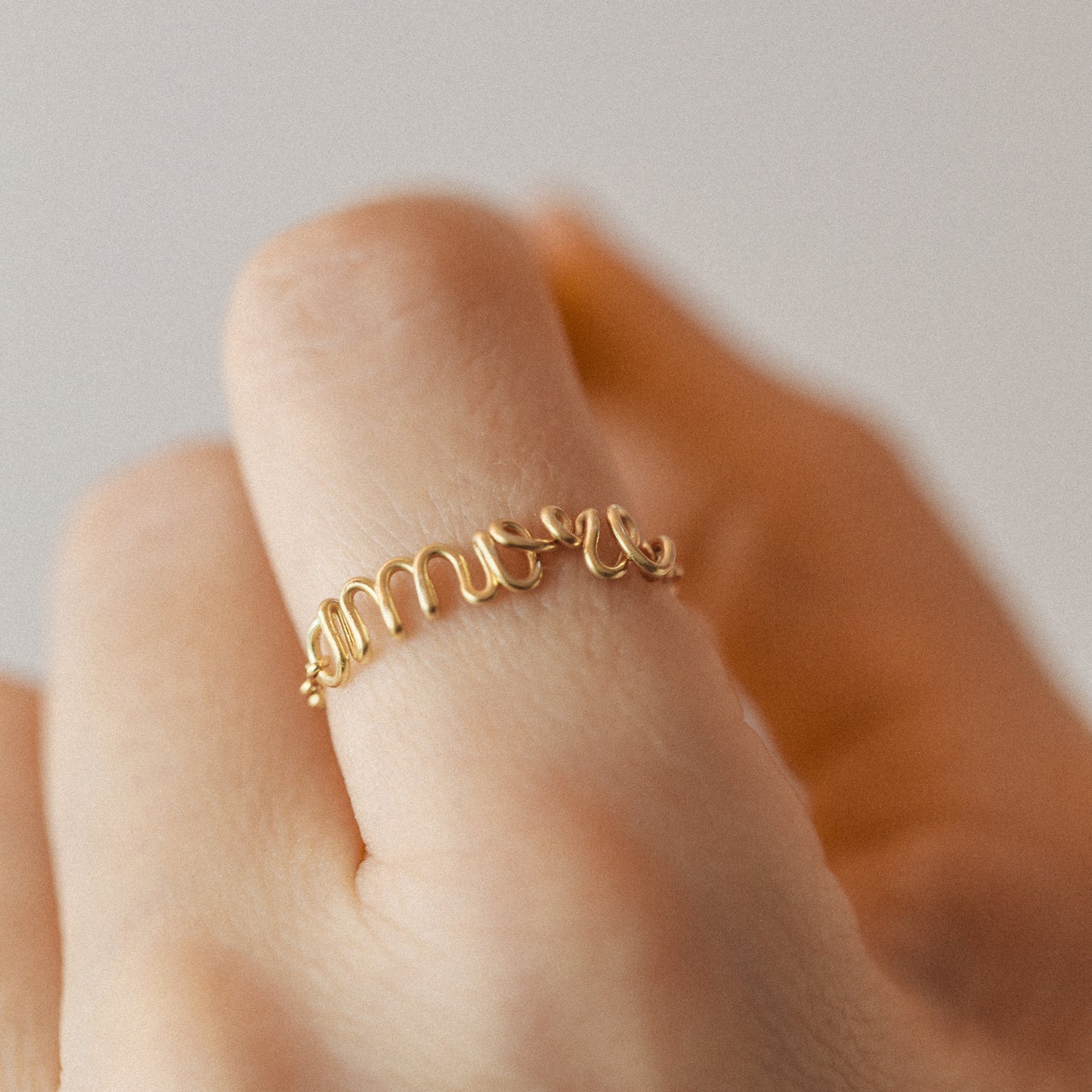 Handmade gold name ring with delicate chain detail