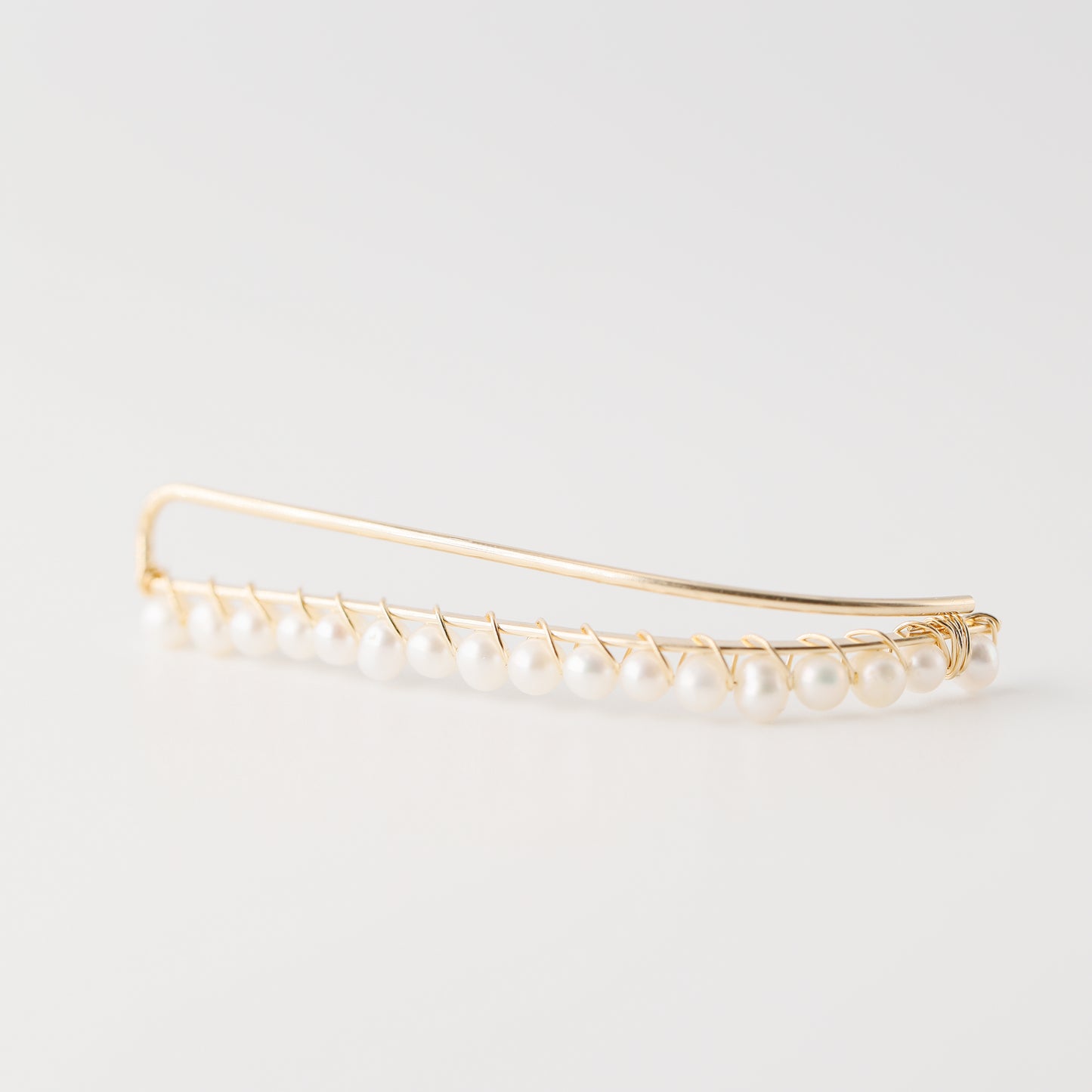 Handmade 50 mm pearl ear climber earrings worn along the natural curve of the ear, featuring tiny 2–3 mm pearls arranged in a delicate climbing design for one standard lobe piercing, available as a pair, single left ear climber or single right ear climber in solid 925 sterling silver, 14k gold filled and 14k rose gold filled, with ear climber lengths available from 10mm to 50mm.