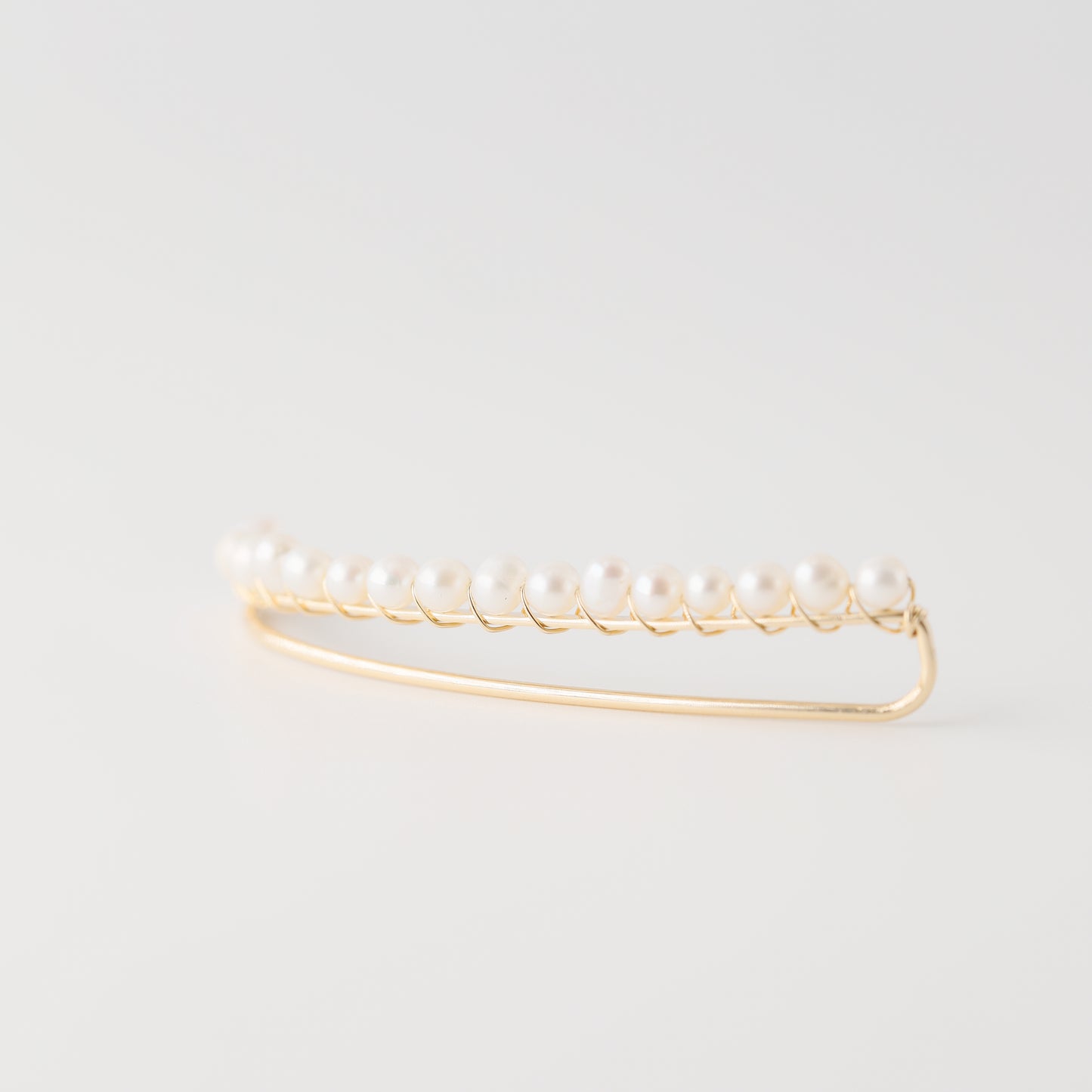 Handmade 50 mm pearl ear climber earrings worn along the natural curve of the ear, featuring tiny 2–3 mm pearls arranged in a delicate climbing design for one standard lobe piercing, available as a pair, single left ear climber or single right ear climber in solid 925 sterling silver, 14k gold filled and 14k rose gold filled, with ear climber lengths available from 10mm to 50mm.