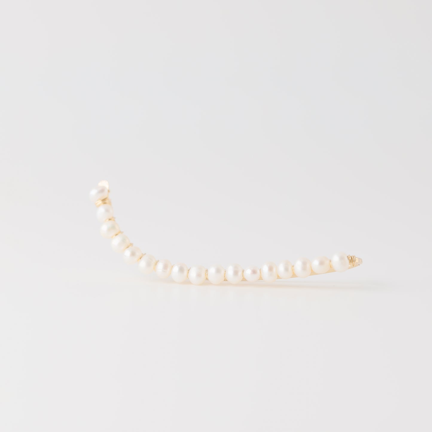 Handmade 50 mm pearl ear climber earrings worn along the natural curve of the ear, featuring tiny 2–3 mm pearls arranged in a delicate climbing design for one standard lobe piercing, available as a pair, single left ear climber or single right ear climber in solid 925 sterling silver, 14k gold filled and 14k rose gold filled, with ear climber lengths available from 10mm to 50mm.