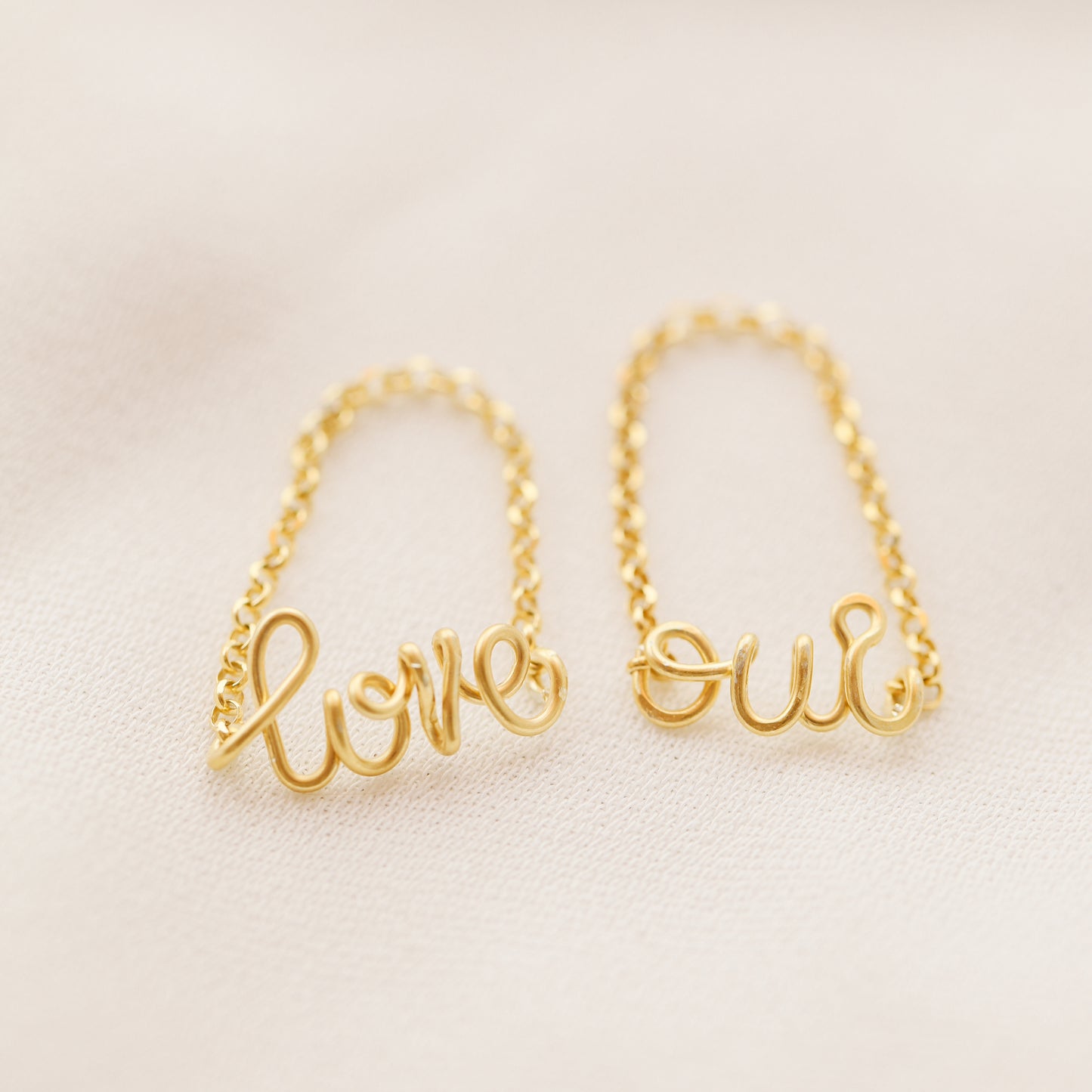 Handmade gold name ring with delicate chain detail