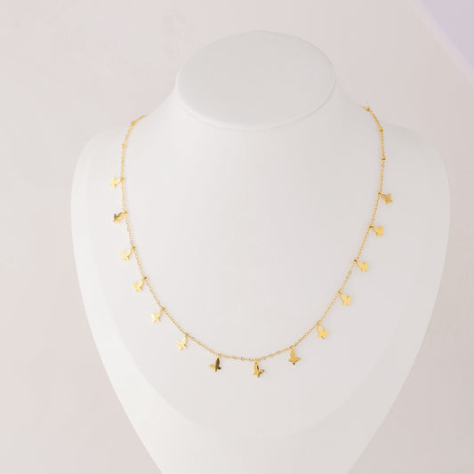 Indulge in the ethereal charm of our Butterflies Necklace! This dainty and minimal boho beaded necklace features delicate gold butterflies, creating a layered and feminine look. Perfect for adding a touch of bohemian flair to any outfit. Elevate your style with our Butterflies Necklace!