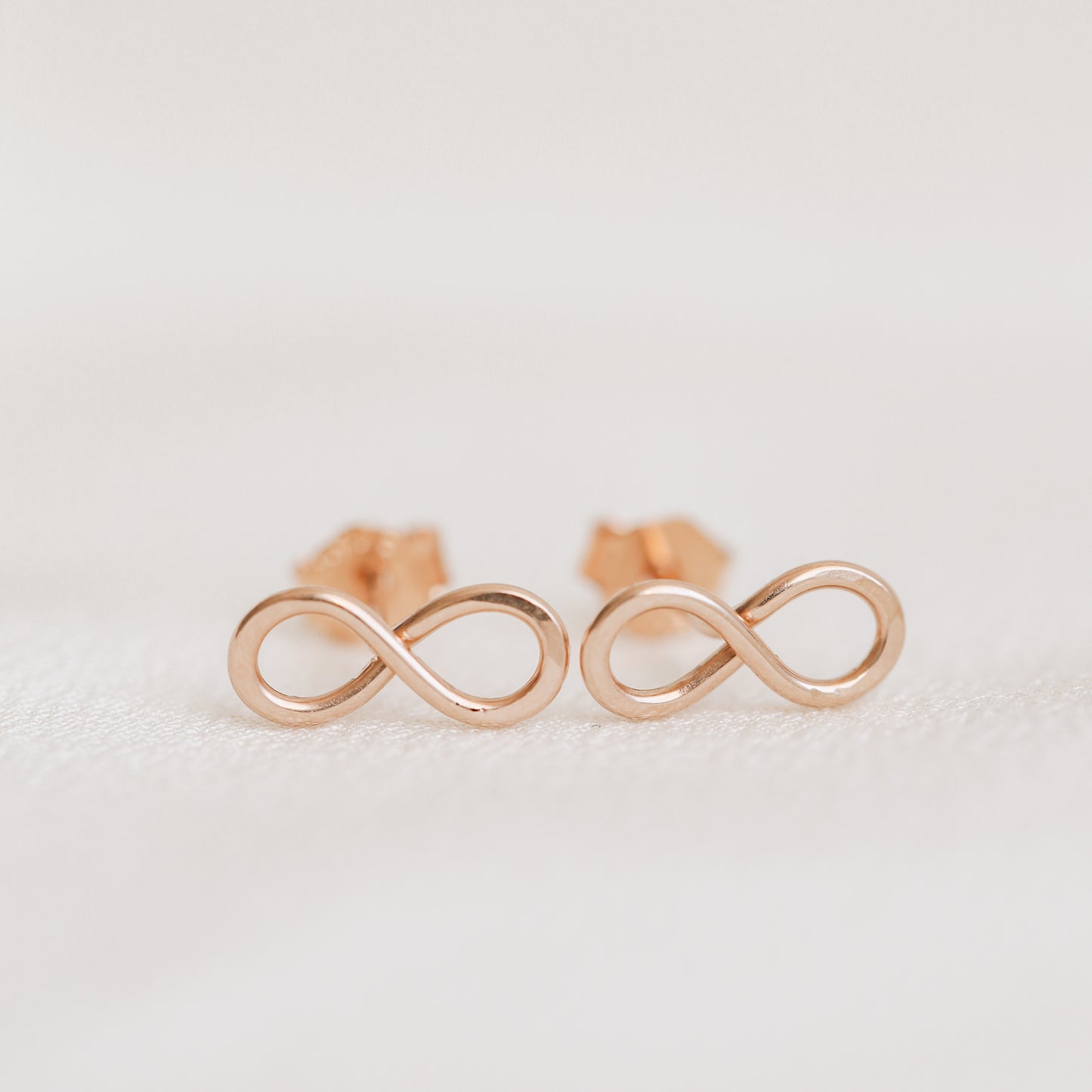 Rose gold infinity knot stud earrings dainty minimalist jewelry