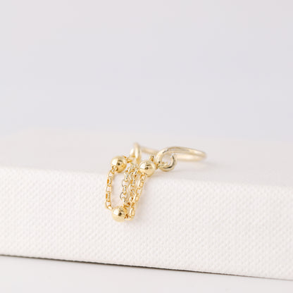 Gold beaded chain ear cuff worn on the conch with double draped chain detail