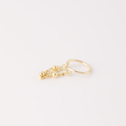 Gold beaded chain ear cuff worn on the conch with double draped chain detail