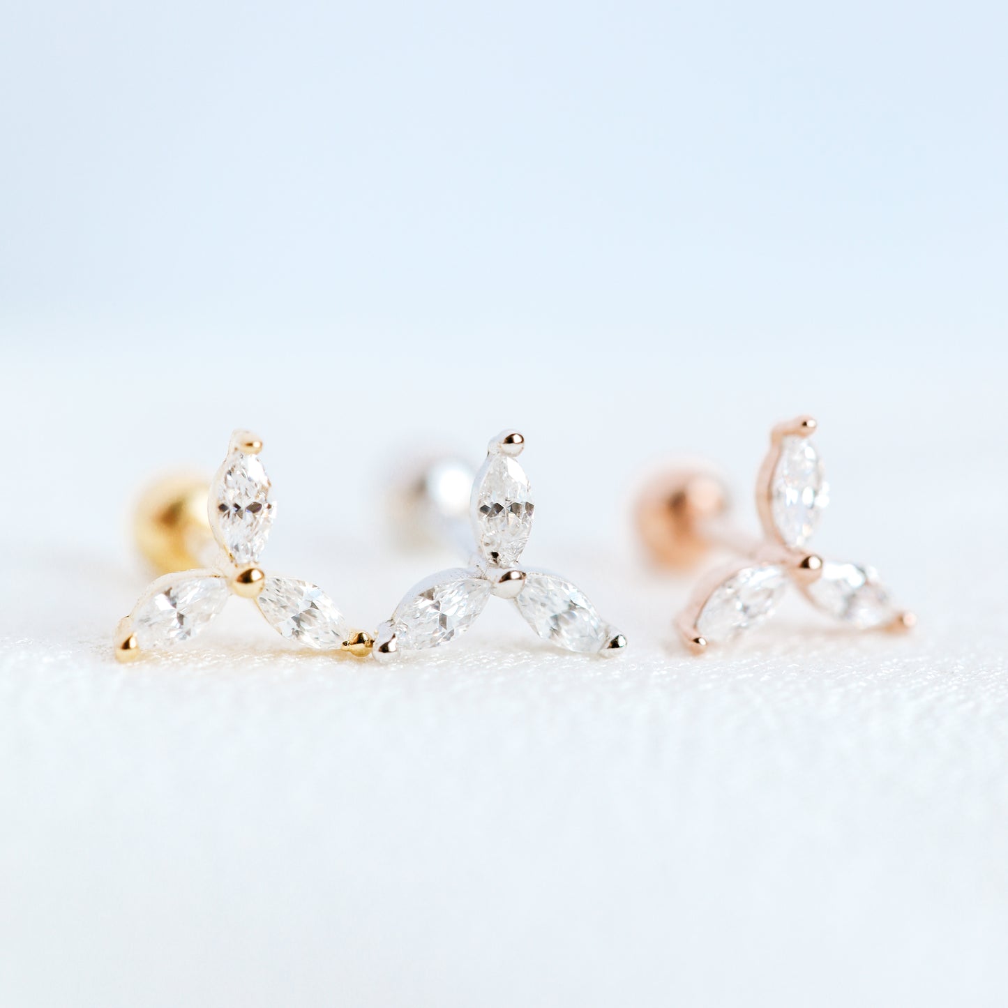 Minimal three stone cartilage stud available in gold silver and rose gold