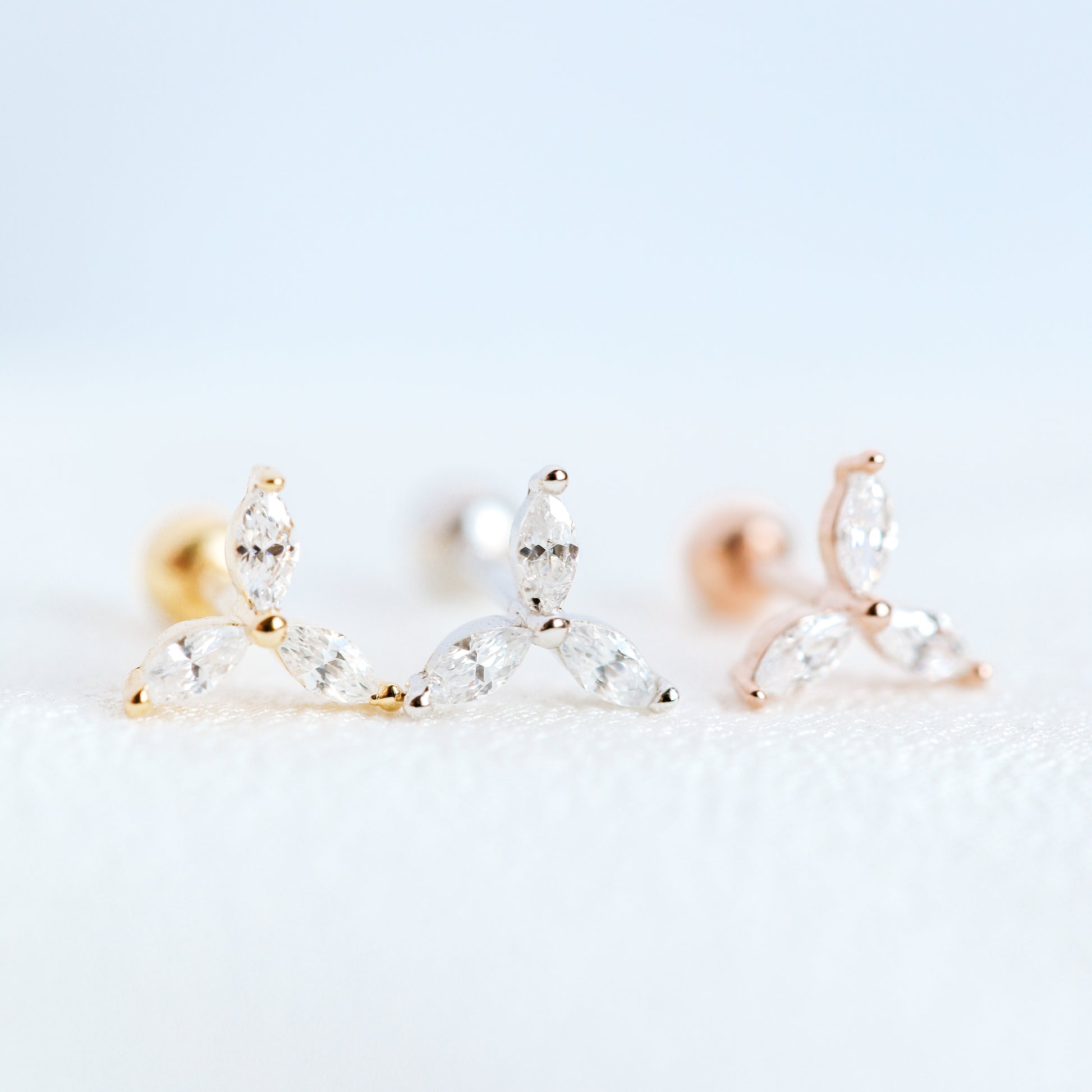 Minimal three stone cartilage stud available in gold silver and rose gold