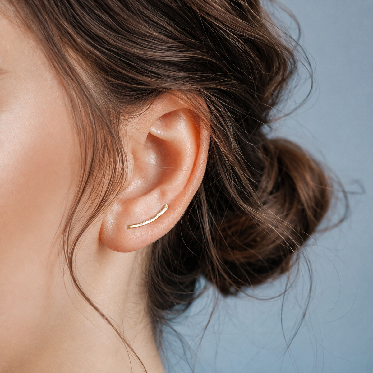 Handmade 15 mm minimalist ear climber earrings worn through one standard lobe piercing and rotated upward along the natural curve of the ear, featuring a petite hand hammered wire design with a short dainty ear sweep shape, available as a single left ear climber, single right ear climber or pair in solid 925 sterling silver, 14k gold filled and 14k rose gold filled, with length options from 10mm to 50mm.