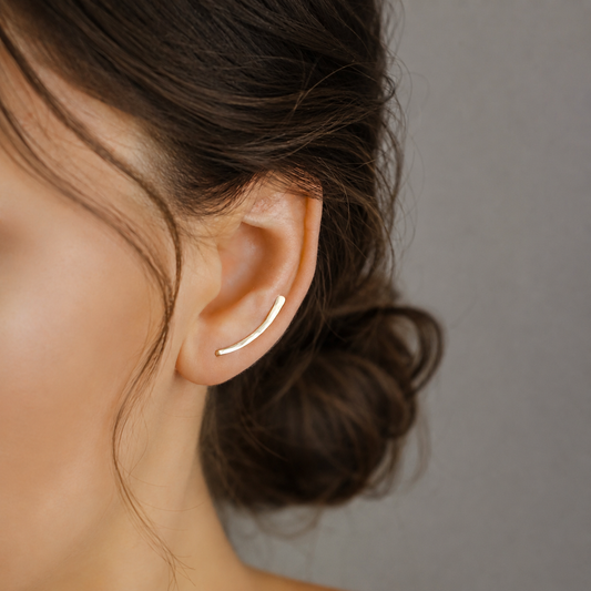 Handmade 20 mm minimalist ear climber earrings worn through one standard lobe piercing and rotated upward along the natural curve of the ear, featuring a small hand hammered wire design with a subtle close-to-ear sweep shape, available as a single left ear climber, single right ear climber or pair in solid 925 sterling silver, 14k gold filled and 14k rose gold filled, with length options from 10mm to 50mm.