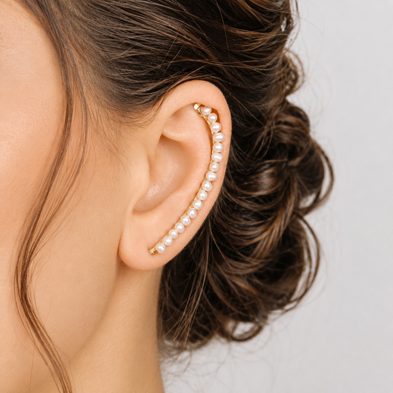 Handmade 50 mm pearl ear climber earrings worn along the natural curve of the ear, featuring tiny 2–3 mm pearls arranged in a delicate climbing design for one standard lobe piercing, available as a pair, single left ear climber or single right ear climber in solid 925 sterling silver, 14k gold filled and 14k rose gold filled, with ear climber lengths available from 10mm to 50mm.