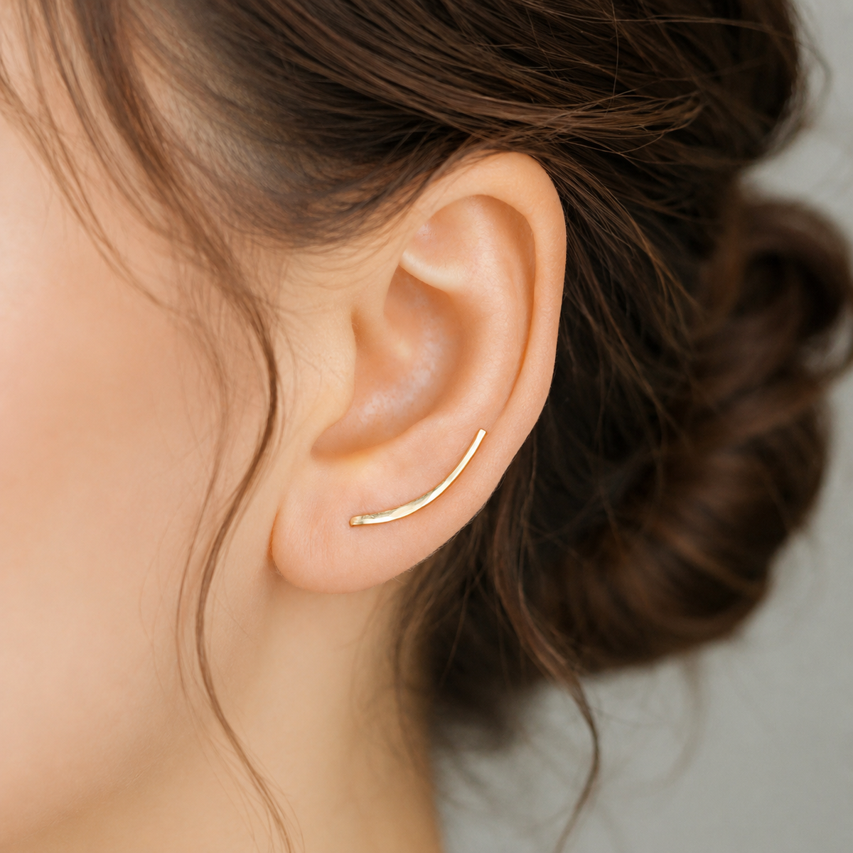 Handmade 20 mm minimalist ear climber earrings worn through one standard lobe piercing and rotated upward along the natural curve of the ear, featuring a small hand hammered wire design with a subtle close-to-ear sweep shape, available as a single left ear climber, single right ear climber or pair in solid 925 sterling silver, 14k gold filled and 14k rose gold filled, with length options from 10mm to 50mm.